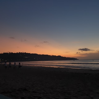A beautiful sunset over a beach during a family vacation.