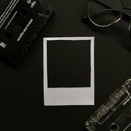 black cassette tape on white printer paper