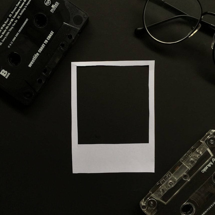 black cassette tape on white printer paper