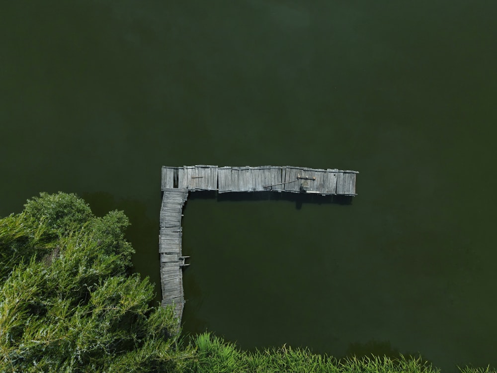 white wooden bridge over river