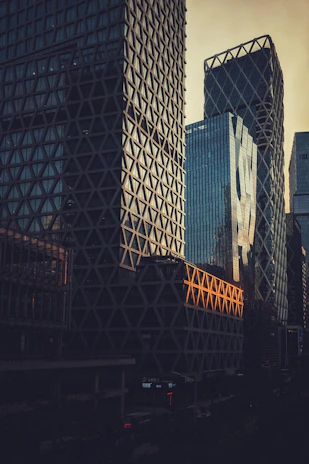 A modern high-rise building in Jeddah at sunset, showcasing lamaj's architectural style.