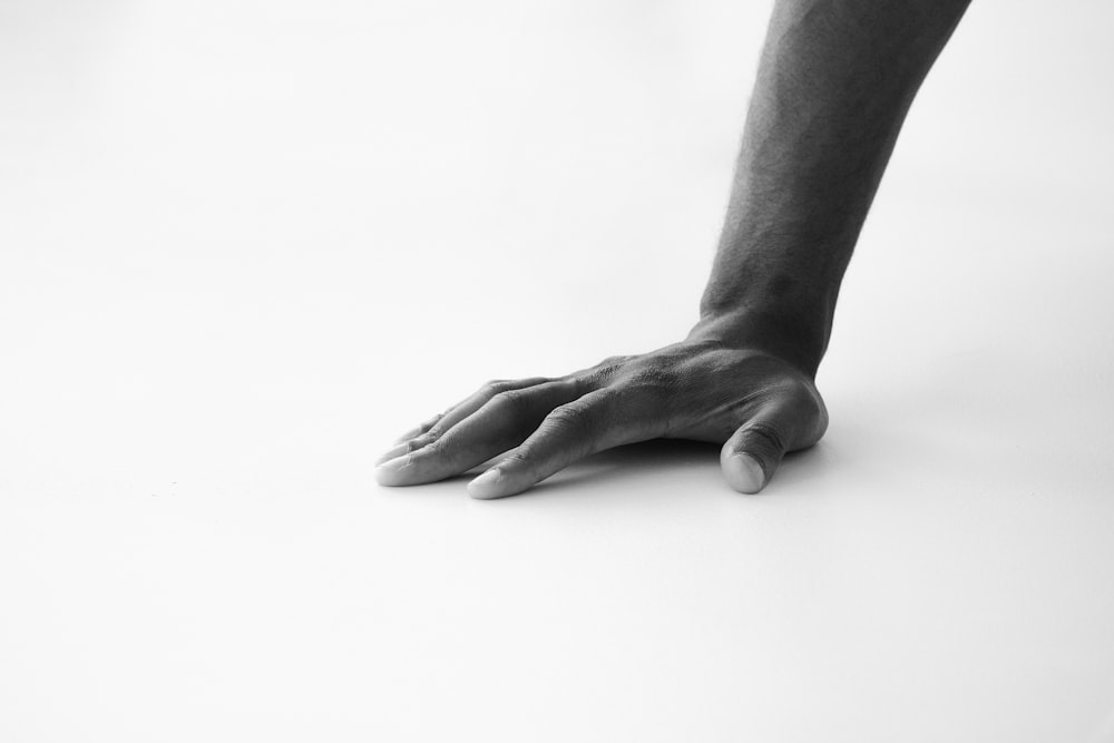 grayscale photo of persons hand