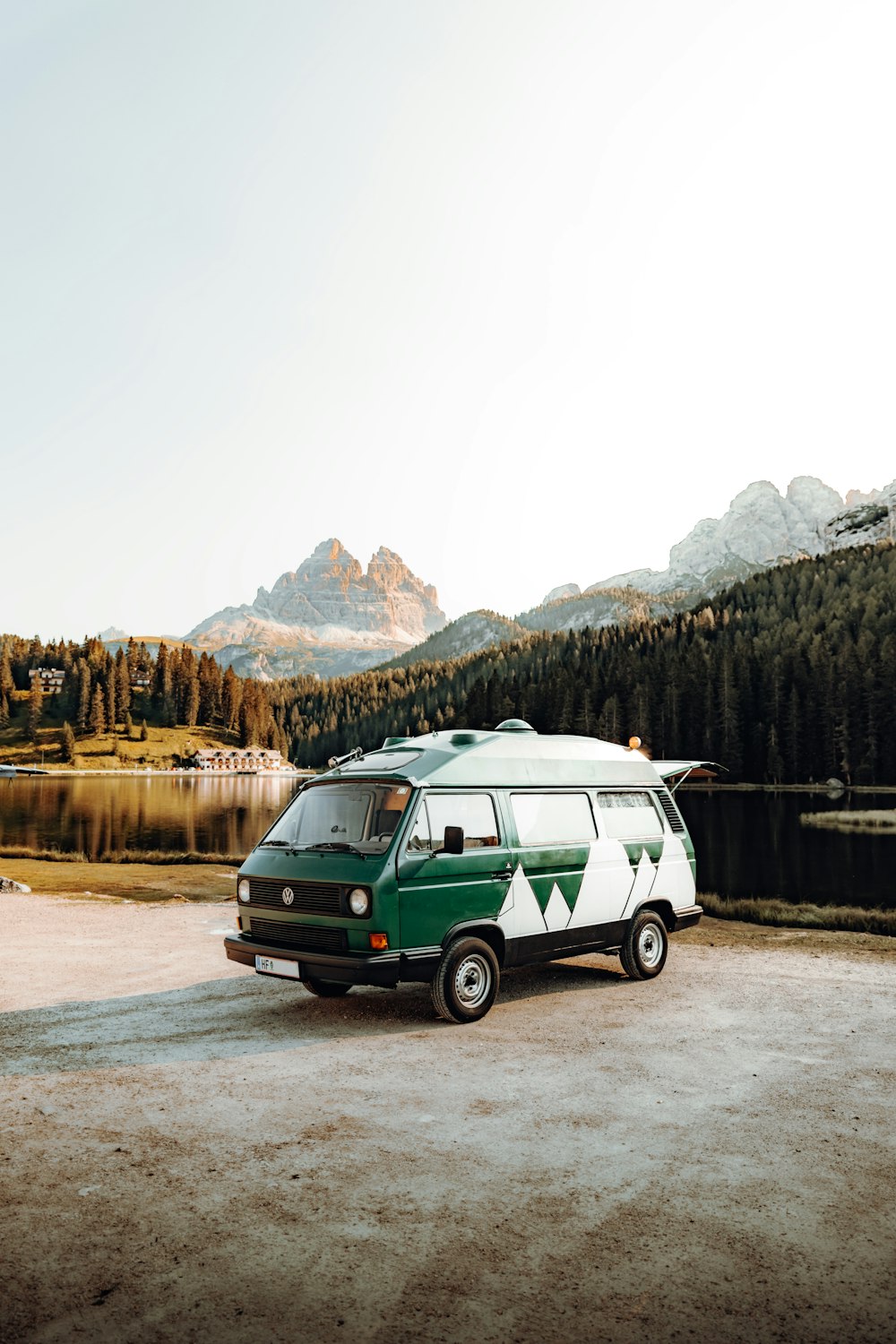 green and white van on road near mountain during daytime