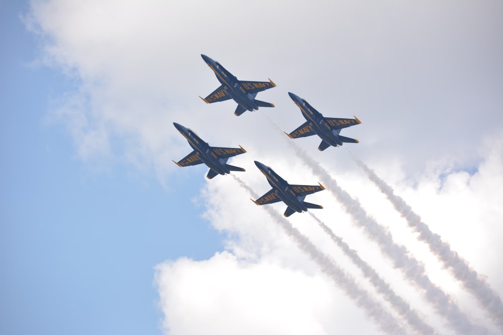 four fighter planes in mid air