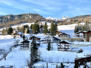 High-resolution still from the Edelweiss animation showcasing the snowy chalet scene.