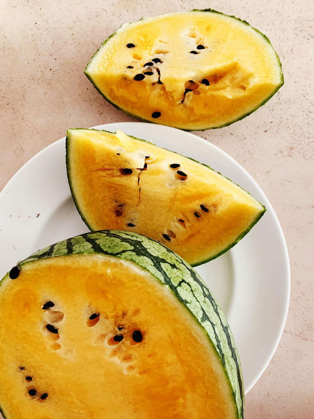 sliced fruit on white and blue ceramic plate