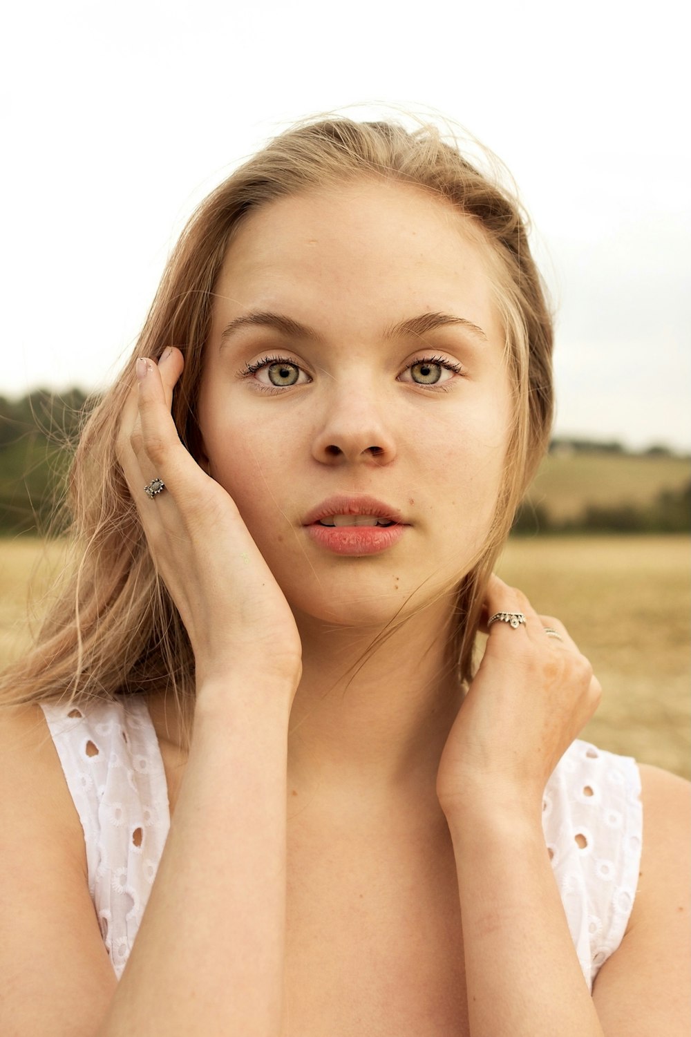 woman in white sleeveless top