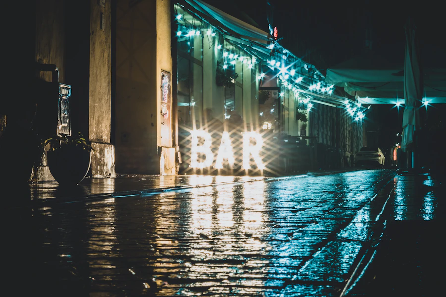Rainy Łódź street glowing after dark