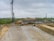 An expansive view of a bustling construction site with workers collaborating on a large project.