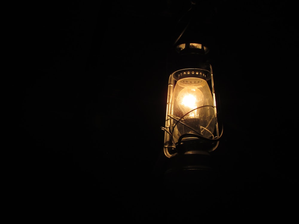 black and brown lamp turned on during nighttime