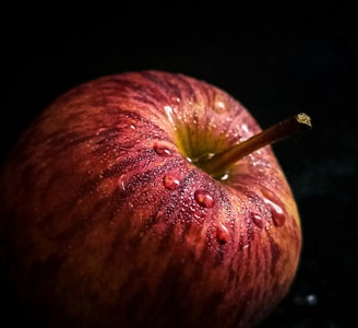 red apple fruit with black background