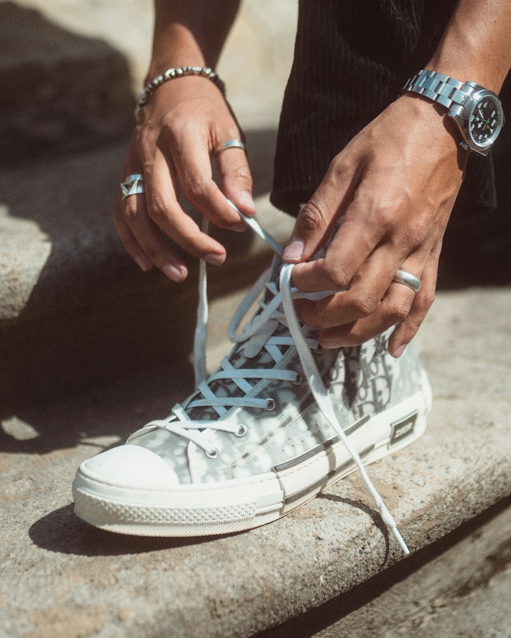 person holding white nike air force 1 high