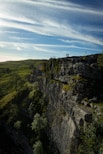 person standing on top of mountain during daytime