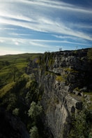 person standing on top of mountain during daytime