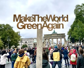 The Greens standing together with diverse world leaders at an international summit.