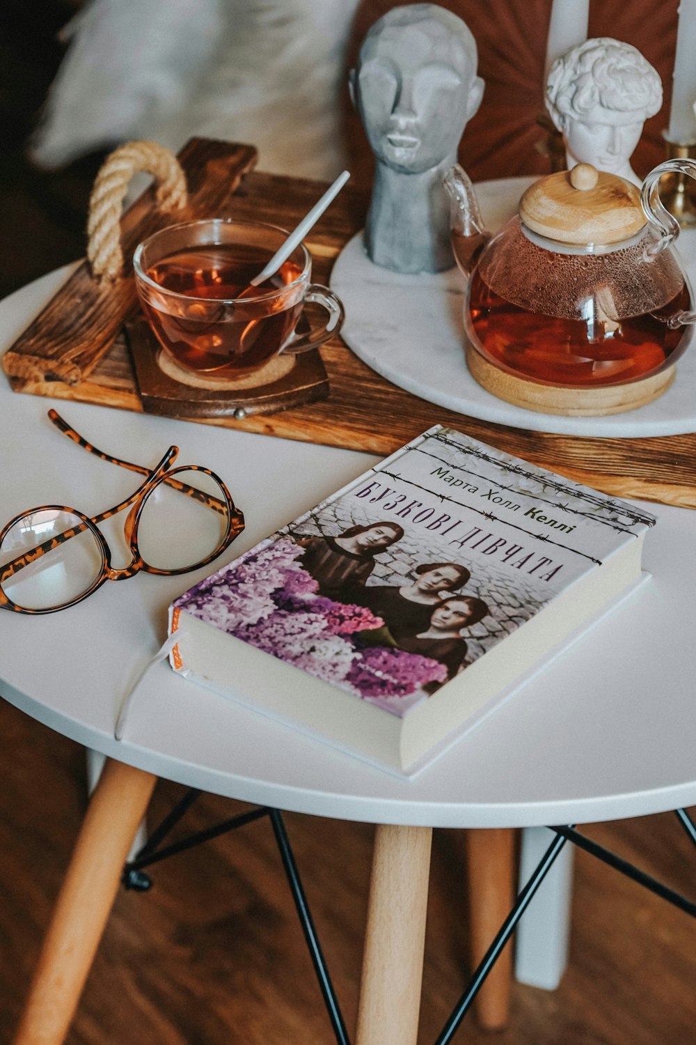 brown framed eyeglasses on white wooden table