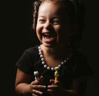 girl in black crew neck t-shirt smiling