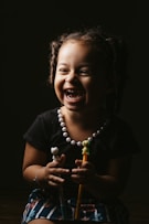 girl in black crew neck t-shirt smiling