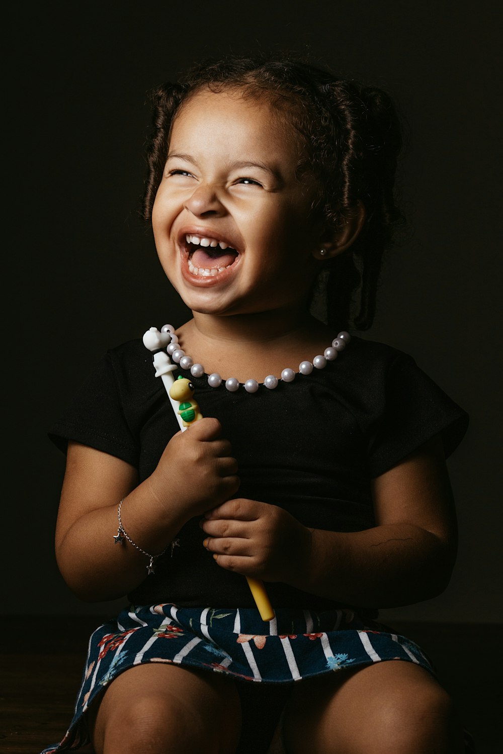 girl in black crew neck t-shirt smiling