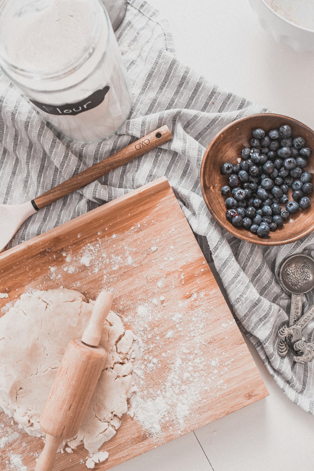 black berries on brown wooden bowl