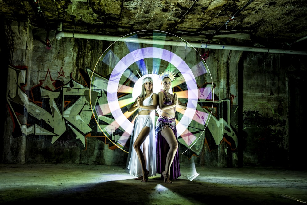 woman in white and black dress standing on tunnel