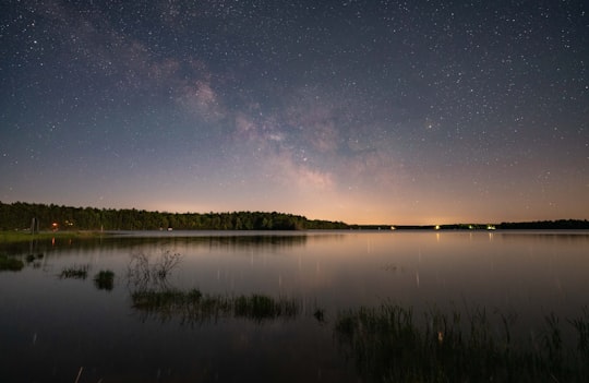 body of water near trees during night time in Webb Lake United States