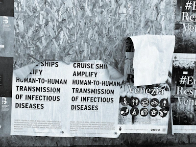 Close-up of scientific posters displayed at a medical symposium focused on aging and prevention.