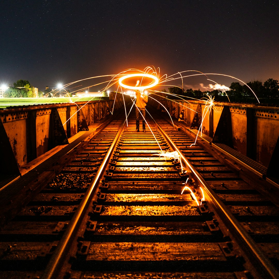 brown wooden bridge during night time