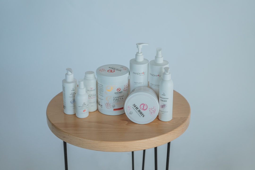 white plastic bottles on brown wooden table