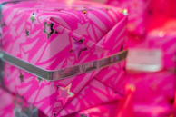 A gift box wrapped with a ribbon, containing assorted merchandise items peeking out.