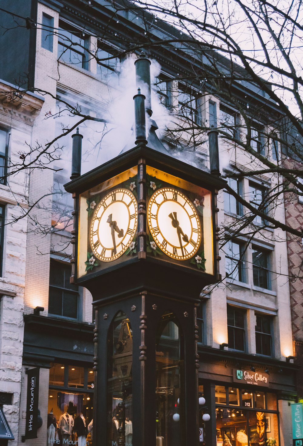 brown wooden analog clock at 10 00