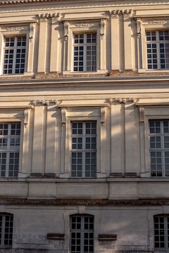 Elegant downtown office building facade bathed in soft morning light.