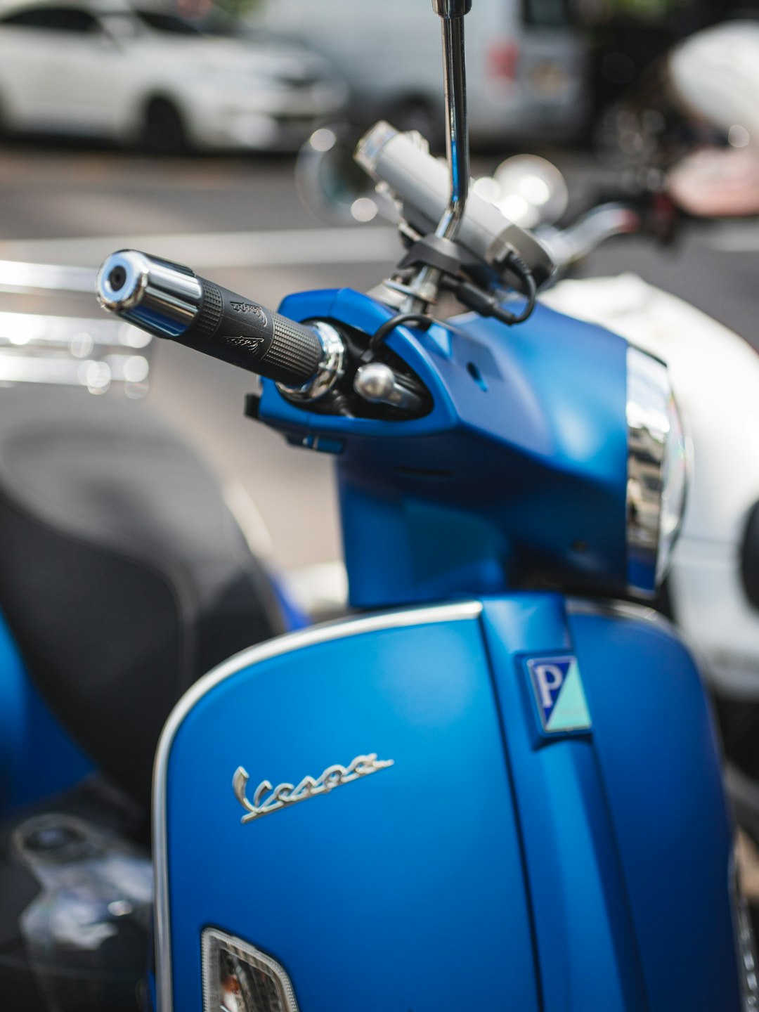 blue and black motorcycle in close up photography