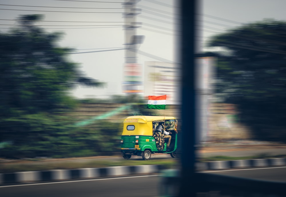 blue and yellow bus on road during daytime