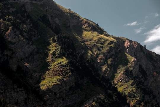 green and brown mountain under blue sky during daytime in Cirque de Gavarnie France