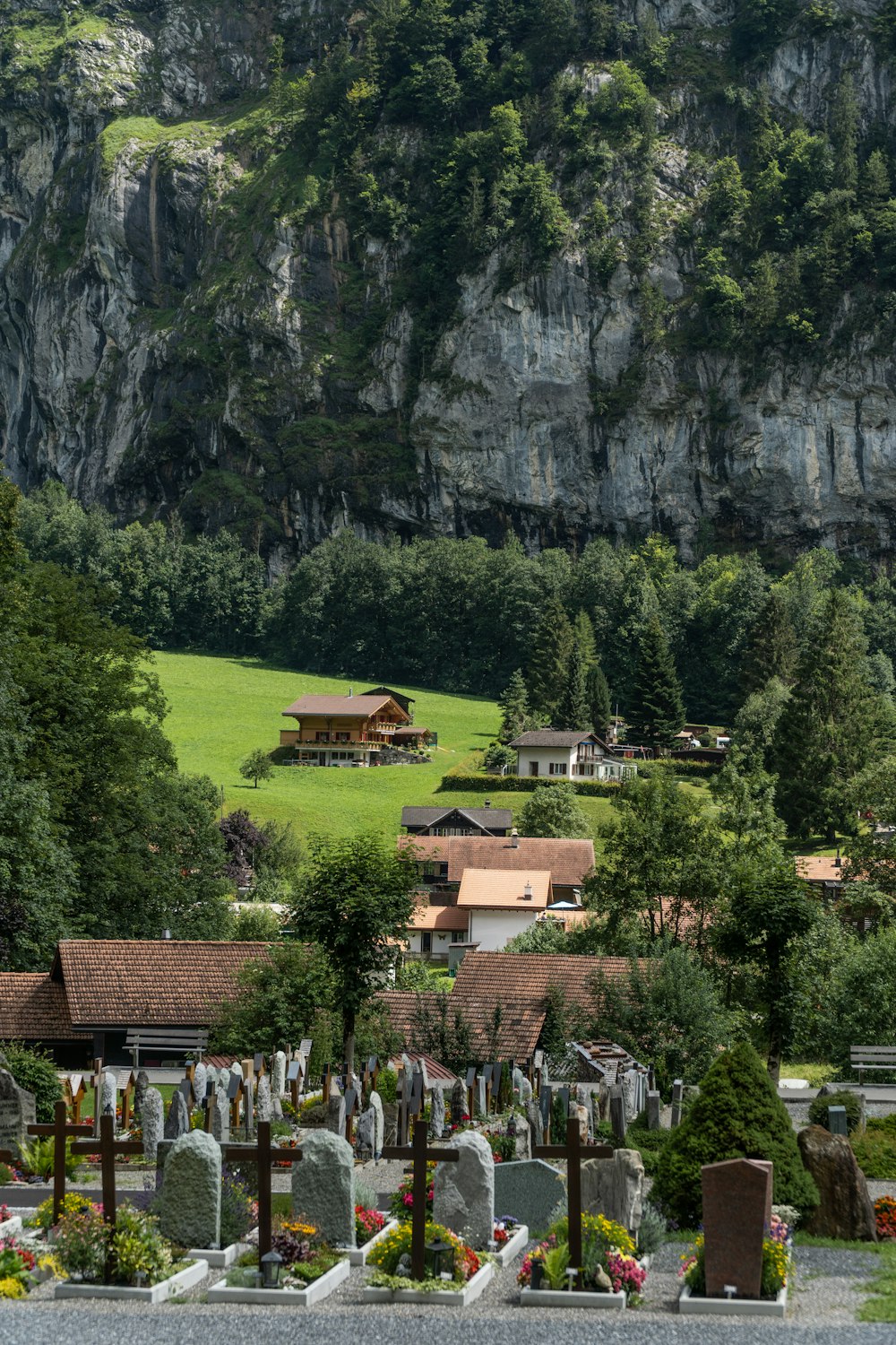 green grass field near mountain during daytime