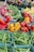 A vibrant assortment of fresh organic fruits and vegetables displayed in a rustic basket.