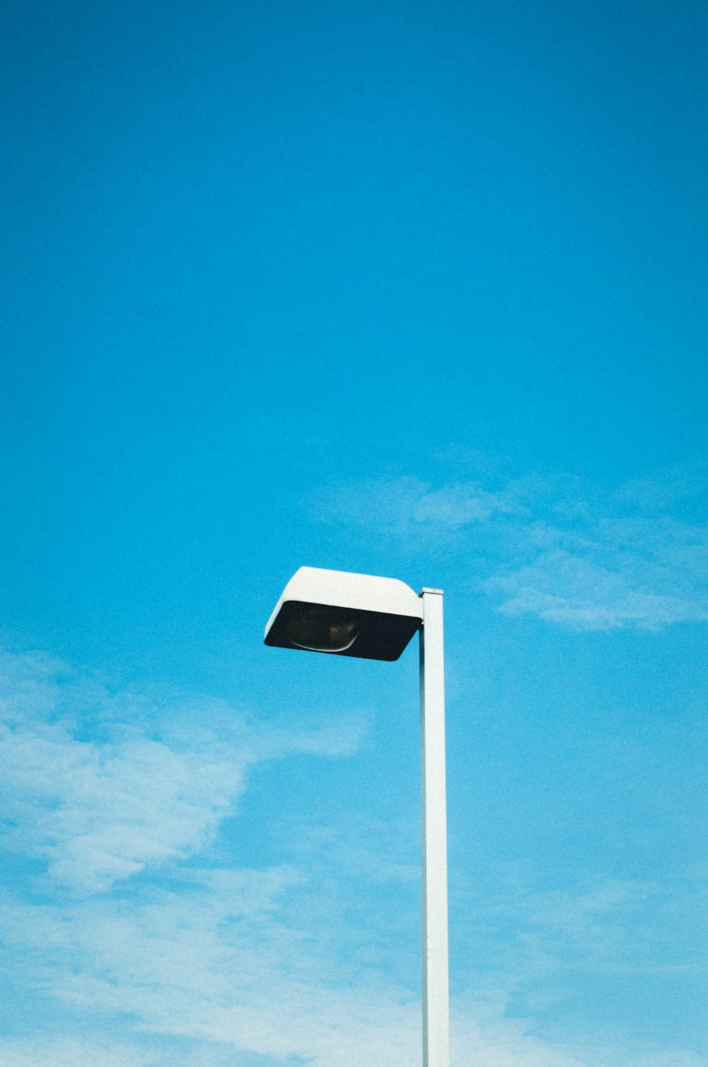 white and black signage under blue sky during daytime