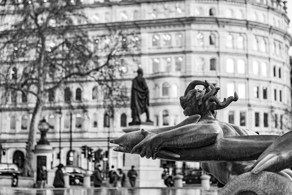 grayscale photo of statue of man