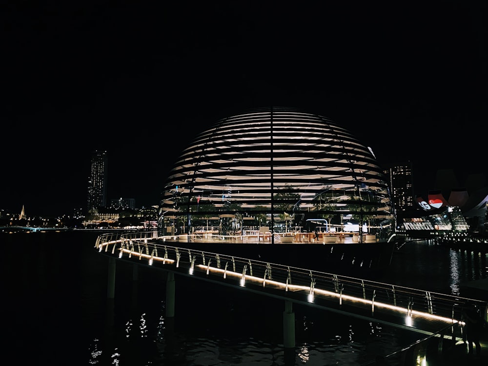 dome building near body of water during night time