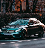 black mercedes benz coupe on road