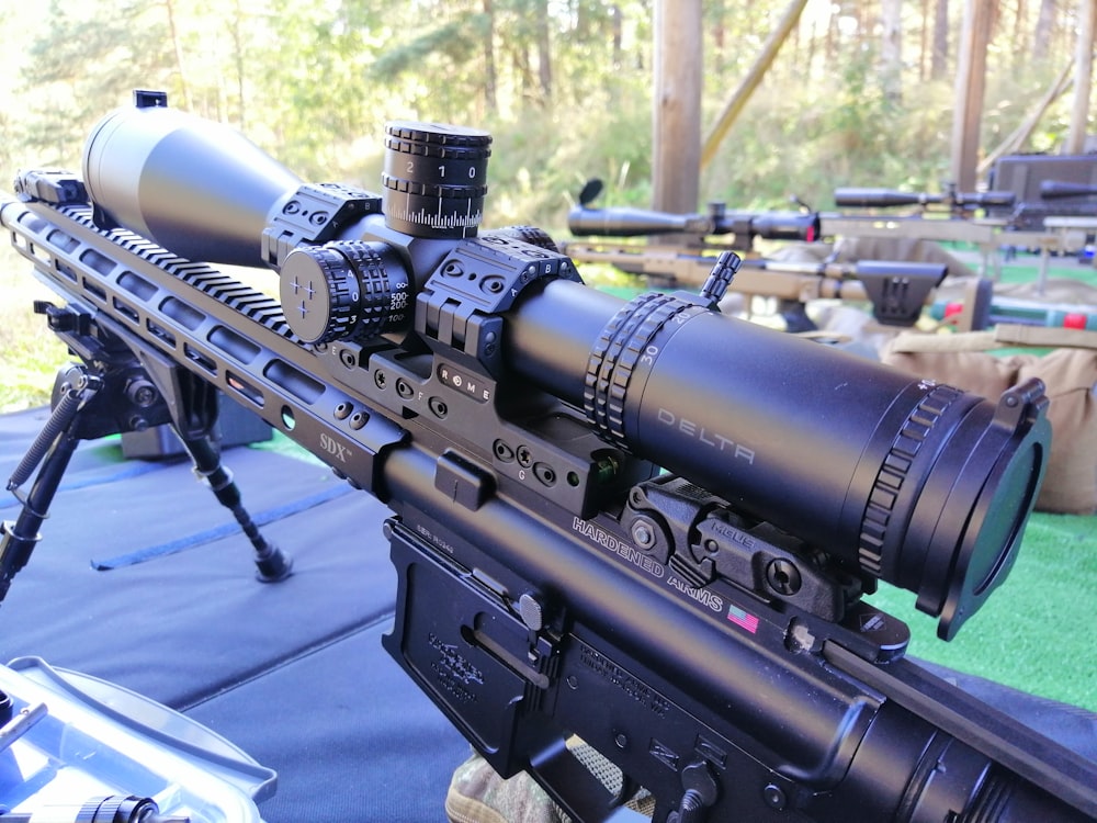 black rifle on blue table