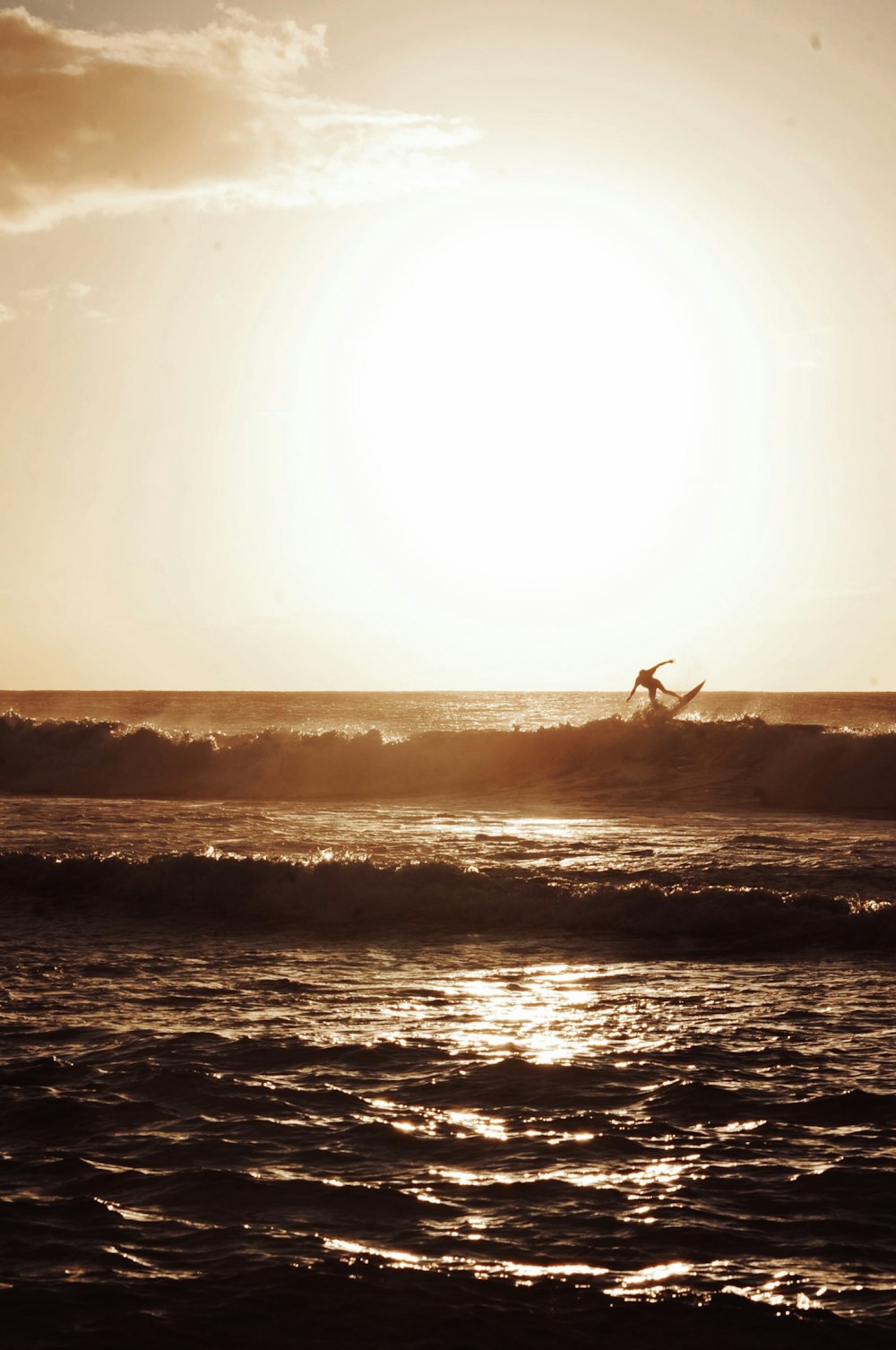 silhouette of person walking on beach during sunset