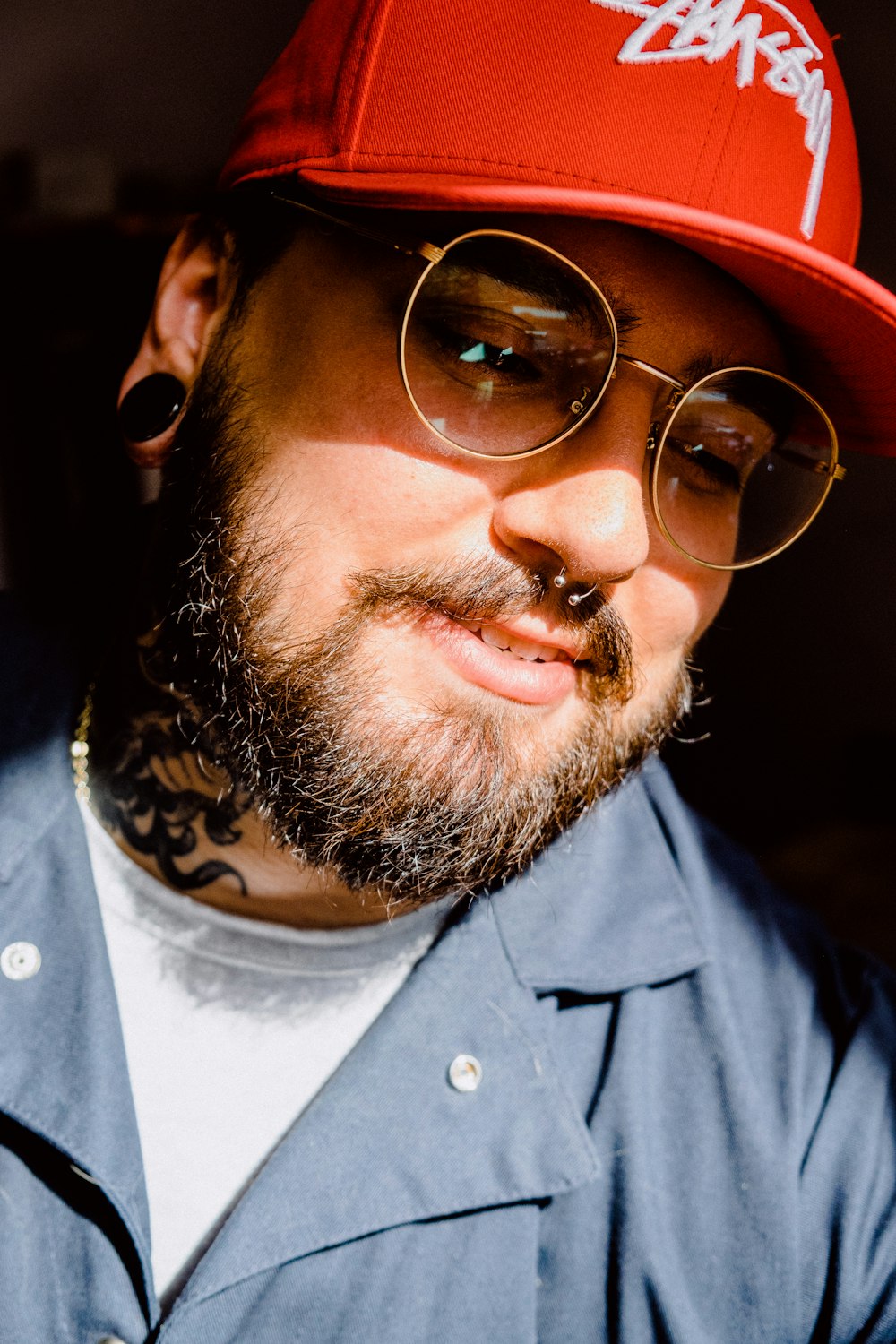 man in grey button up shirt wearing sunglasses