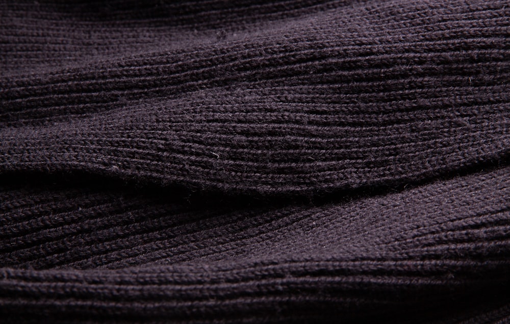 black textile in close up photography
