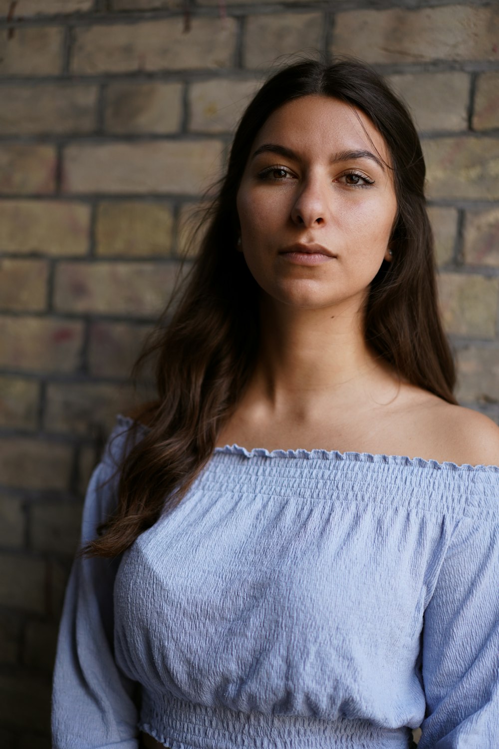 woman in blue off shoulder shirt