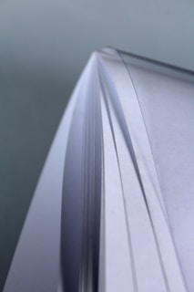 A close-up of a stack of organized documents on a desk.