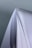 Close-up of hands holding a stack of clean white paper sheets on a wooden desk.
