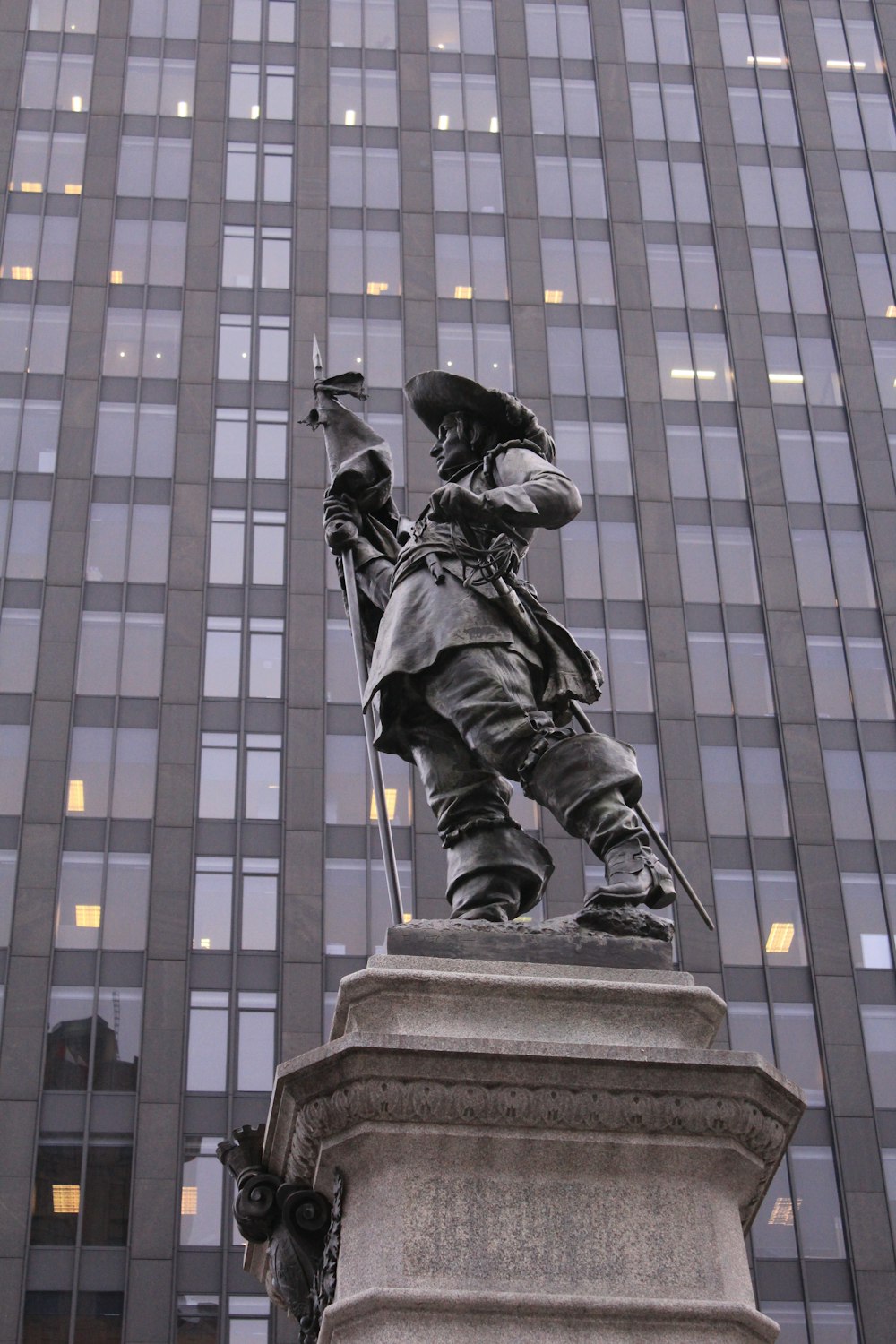 black statue of man in black suit