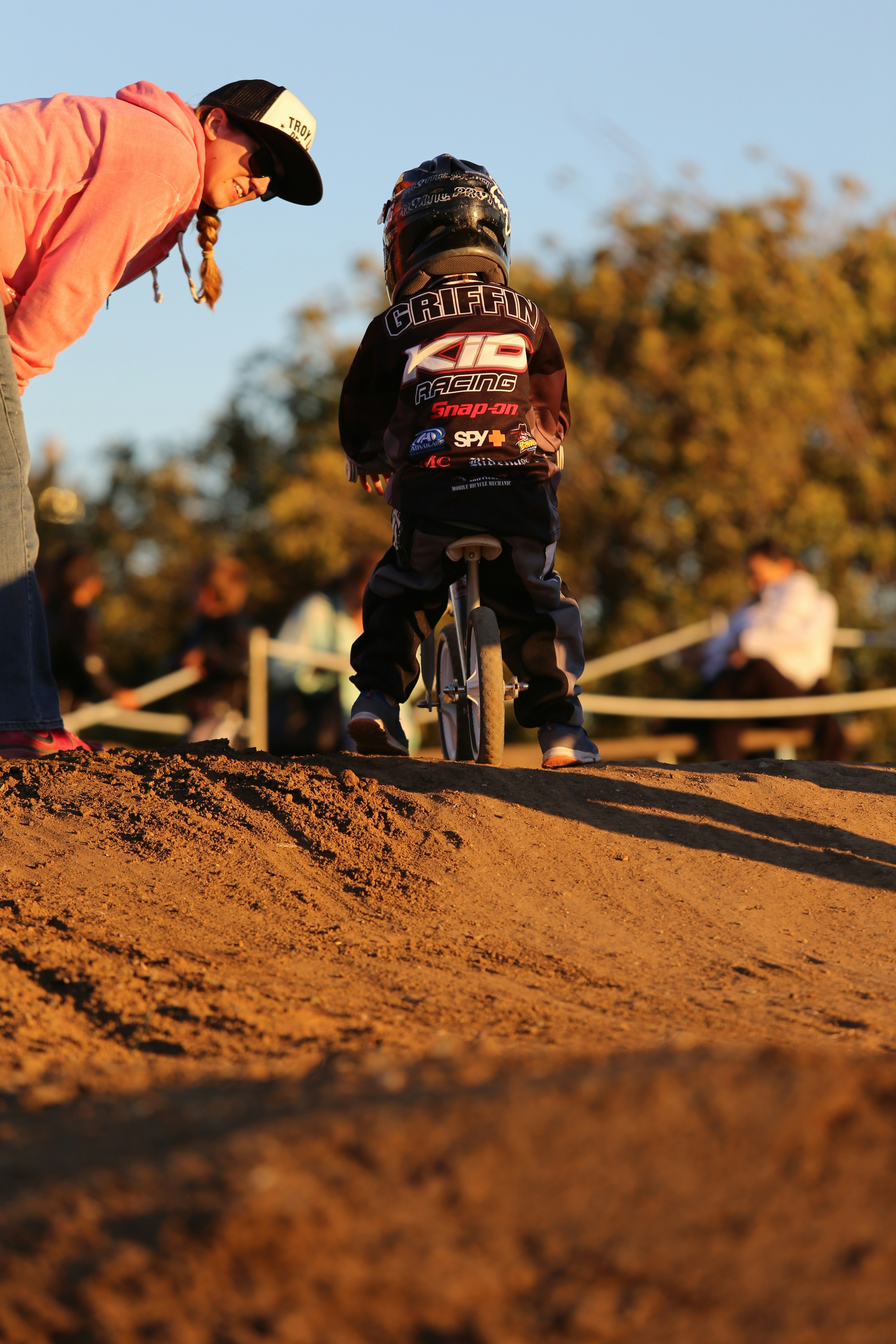 man in red jacket riding bicycle